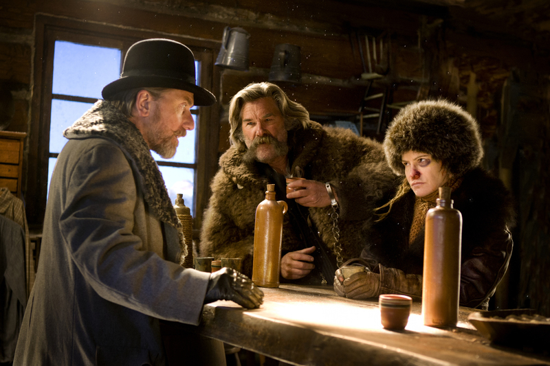 (L-R) TIM ROTH, KURT RUSSELL, and JENNIFER JASON LEIGH star in THE HATEFUL EIGHT.  Photo: Andrew Cooper, SMPSP © 2015 The Weinstein Company. All Rights Reserved.